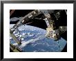 The Docked Space Shuttle Atlantis (Sts-115) And A Soyuz Spacecraft by Stocktrek Images Limited Edition Print