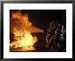 Firefighters Extinguishing A Simulated Battery Fire by Stocktrek Images Limited Edition Print