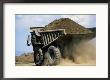 A Dump Truck Carrying Gravel Kicks Up A Cloud Of Dust by Raymond Gehman Limited Edition Pricing Art Print