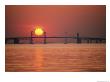 View From The Water Of The Chesapeake Bay Bridge And The Setting Sun by Kenneth Garrett Limited Edition Print