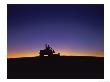 Silhouette Of Worker Cutting Grass At Sunrise by Kent Dufault Limited Edition Print