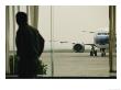 Man At A Chinese Airport Walks Past An Airplane Parked Outside by Eightfish Limited Edition Print