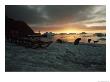 Twilight View Of Sled Dogs And Sled On Shore With Boat In Distance by Bill Curtsinger Limited Edition Print
