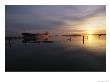 Twilight View Of A Ship At Anchor In Still Water At Low Tide by Bill Curtsinger Limited Edition Print