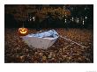 An Illuminated Jack-O-Lantern On The Back Of A Rowboat by Bill Curtsinger Limited Edition Print