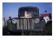 The Ruins Of A Car Sit In An Open Field, Steamboat Springs, Colorado by Taylor S. Kennedy Limited Edition Pricing Art Print