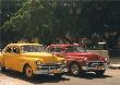 Yellow Car And Orange Taxi by Nelson Figueredo Limited Edition Pricing Art Print