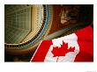 Interior Of Parliament House With Canadian Flag In Foreground, Victoria, Canada by Lawrence Worcester Limited Edition Print