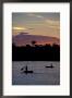 Boaters On Amazon River At Sunset, Amazon River Basin, Peru by Nik Wheeler Limited Edition Print