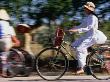 Girl Riding Bike, Ho Chi Minh, Vietnam by John Borthwick Limited Edition Print