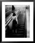 Woman Riding On Escalator In The Time And Life Building by Nina Leen Limited Edition Print