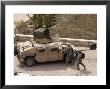 Us Military Soldiers Take A Well Earned Break In The Forground Of The Baghdad Hotel by Stocktrek Images Limited Edition Print