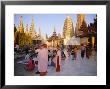 Buddhist Worshippers At The Shwedagon Paya (Shwe Dagon Pagoda), Yangon (Rangoon), Myanmar (Burma) by Christina Gascoigne Limited Edition Print