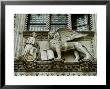 Statue Of Winged Lion Of St Marks And Doge Adorns Building In Venice, Italy by Todd Gipstein Limited Edition Print