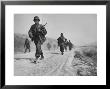 Kicking Up Dust, A Withdrawing Unit Heads South by Joe Scherschel Limited Edition Print