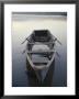 Timeworn Boat Rests On A Calm Lake by Raul Touzon Limited Edition Print