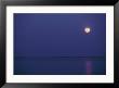 Purple Sky And Moon Over A Body Of Water by Kenneth Garrett Limited Edition Print