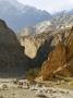 Distant Hikers In A Gorge, Mustang, Nepal, Peaks In Background by Stephen Sharnoff Limited Edition Print