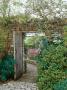 Climbing Rosa, Open Wooden Gate In Stone Wall With View Through To Autumn Borders by Mark Bolton Limited Edition Pricing Art Print