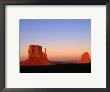 Sunlight Strikes The East And West Mitten Buttes, Monument Valley Navajo Tribal Park, Arizona by Mark Newman Limited Edition Print