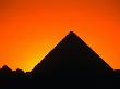 Pyramids Of Giza Silhouetted At Sunset,Cairo, Egypt by Lee Foster Limited Edition Print