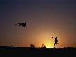 Boy Flying Kite At Sunset, England, United Kingdom by Chris Mellor Limited Edition Print