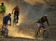 People On A Mountain Biking Safari At Mashatu Game Reserve, Botswana by Roger De La Harpe Limited Edition Print