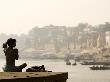 Man Stretching During His Morning Yoga Exercises Overlooking The Holy River Ganges by Gavin Gough Limited Edition Pricing Art Print