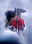 Man Looking Into Snow Cave, Maligne, Jasper, Canada by Lee Foster Limited Edition Print