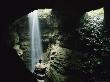 Caver Stands Underground In Front Of A Waterfall by Stephen Alvarez Limited Edition Print