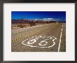 Route 66 Sign On Highway Near Amboy, Mojave Desert, California by Witold Skrypczak Limited Edition Print