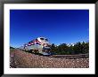 Amtrak Train At Marias Pass, Montana, Usa by Chuck Haney Limited Edition Print