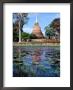 The Lotus Pond And Stupa In Sukhothai Historical Park, Thailand by Glenn Beanland Limited Edition Print