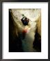 A Kayaker Sails Over A Waterfall And Is Headed For The Rough White Water Below by Barry Tessman Limited Edition Print