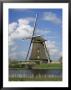 Canal And Windmill At Kinderdijk, Unesco World Heritage Site, Holland by Gavin Hellier Limited Edition Print