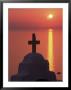Church Cross Against The Sunset, Island Of Mykonos, Hora, Cyclades, Greece by Gavin Hellier Limited Edition Print