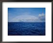 A Rainbow Rises Over The Waters Surface In Twofold Bay by Jason Edwards Limited Edition Print