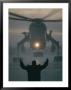 A Man Guides A Landing Helicopter by Lowell Georgia Limited Edition Pricing Art Print