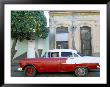 Old American Car Parked On Beneath Fruit Tree, Cienfuegos, Cuba, West Indies, Central America by Lee Frost Limited Edition Print