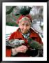 Birds Perched On Mature Woman Sitting In Park by Paul Katz Limited Edition Print