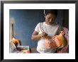 Woman Painting Balsa Wood Sculptures Of Chickens, Rio San Juan, Nicaragua by Margie Politzer Limited Edition Print