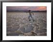 A Man Runs Across The Surface Of Salar De Atacama Salt Flat by Joel Sartore Limited Edition Print