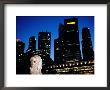 Merlion And City Skyline At Dusk, Singapore, Singapore by Michael Coyne Limited Edition Print