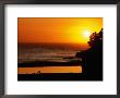 Surfers Walking On Beach At Sunset, Santa Cruz, United States Of America by Jerry Alexander Limited Edition Print