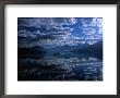 Early Morning Boating, Reflected Sea Of Clouds, Lake Mcdonald, Glacier National Park, Montana, Usa by Gareth Mccormack Limited Edition Print