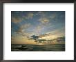 Clouds Silhouetted Against The Setting Sun Over The Pacific Ocean by Steve Winter Limited Edition Print