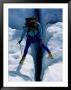 A Climber Steps Over A Crevasse In Root Glacier by Rich Reid Limited Edition Print