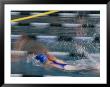 A Swimmer Races Through The Water At A Swimming Competition by Michael S. Lewis Limited Edition Print