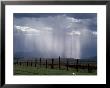 Veils Of Rain Stream From Sunlit Clouds Over Farmland by George Grall Limited Edition Print