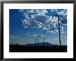 Silhouetted Telephone Poles Under Puffy Clouds by Raymond Gehman Limited Edition Print